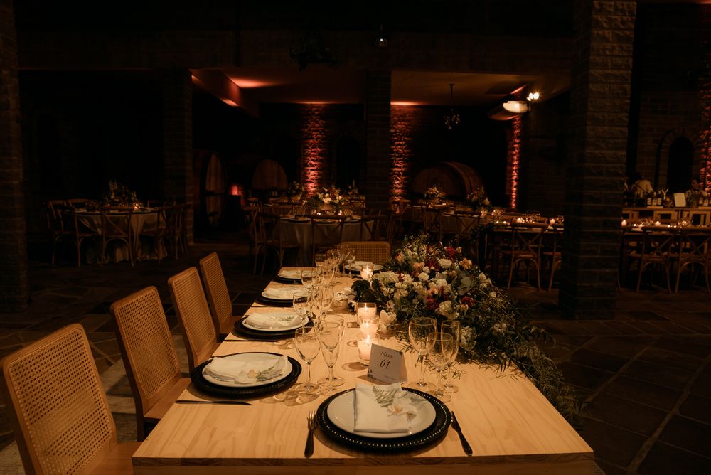 Warm candlelit table prepared for an intimate rehearsal dinner