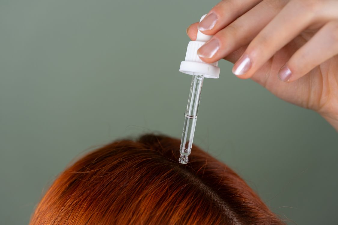Applying Hair Serum with Precision Dropper · Free Stock Photo