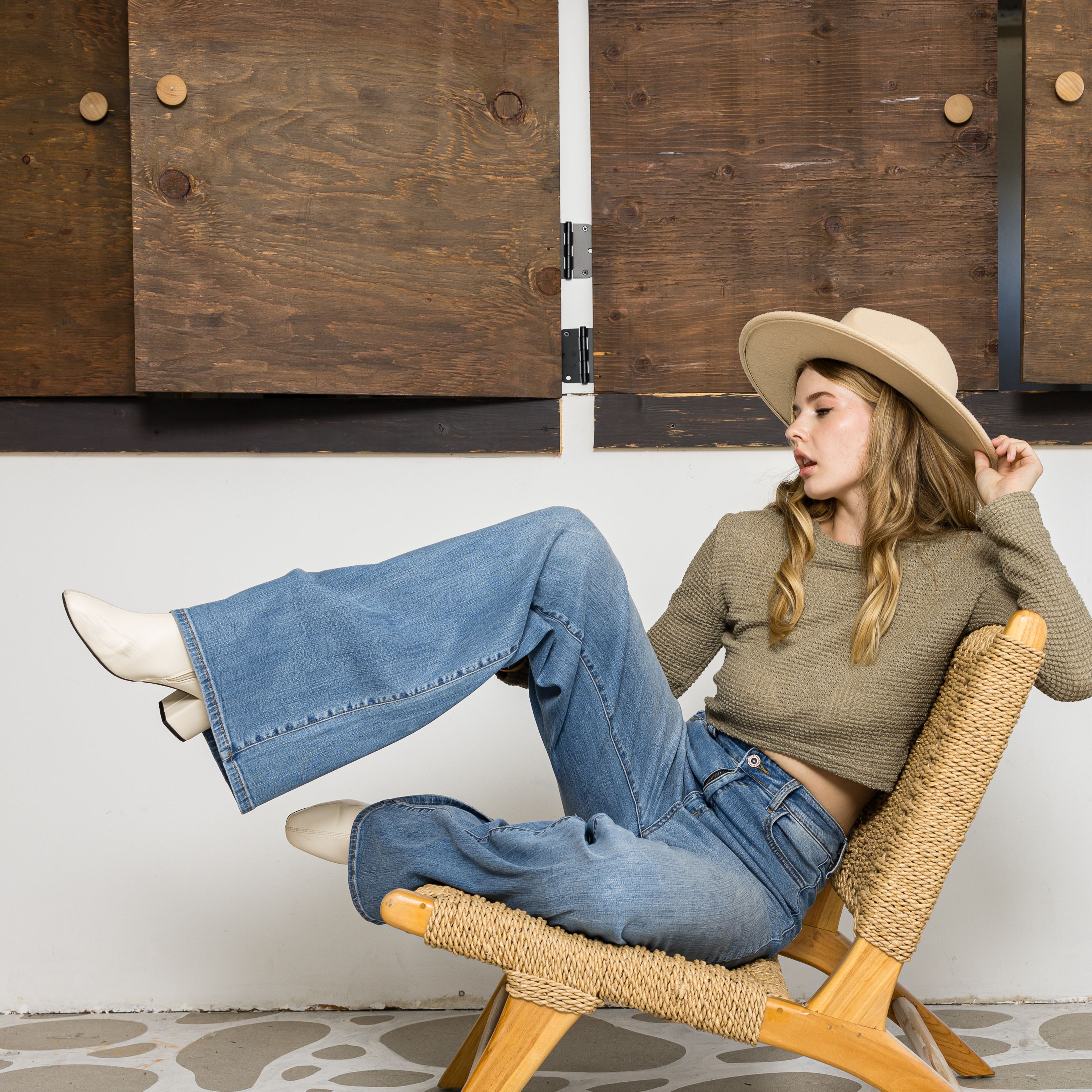 Stylish Woman in Comfortable Denim and Hat Indoors