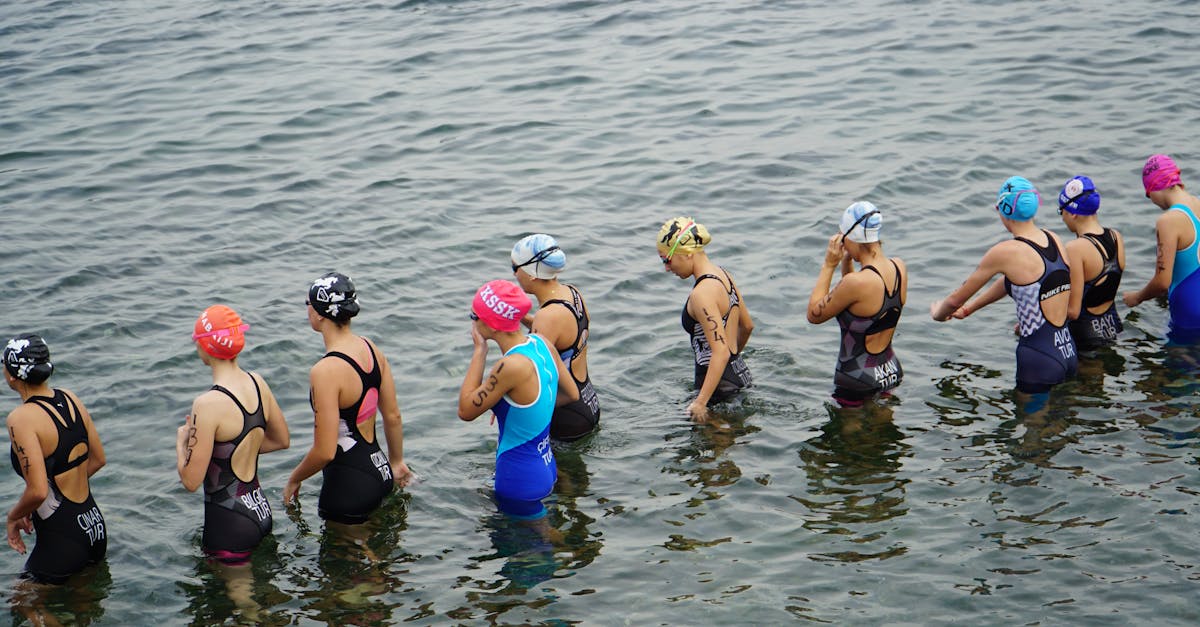 Athletes in wetsuits ready for a triathlon swimming leg in Mudanya, Türkiye.