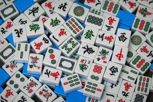 A detailed close-up view of traditional Mahjong tiles with colorful Chinese characters and symbols for gameplay.