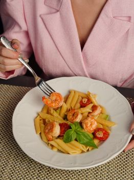 Delicious shrimp pasta topped with fresh basil, perfect for a gourmet dining experience.
