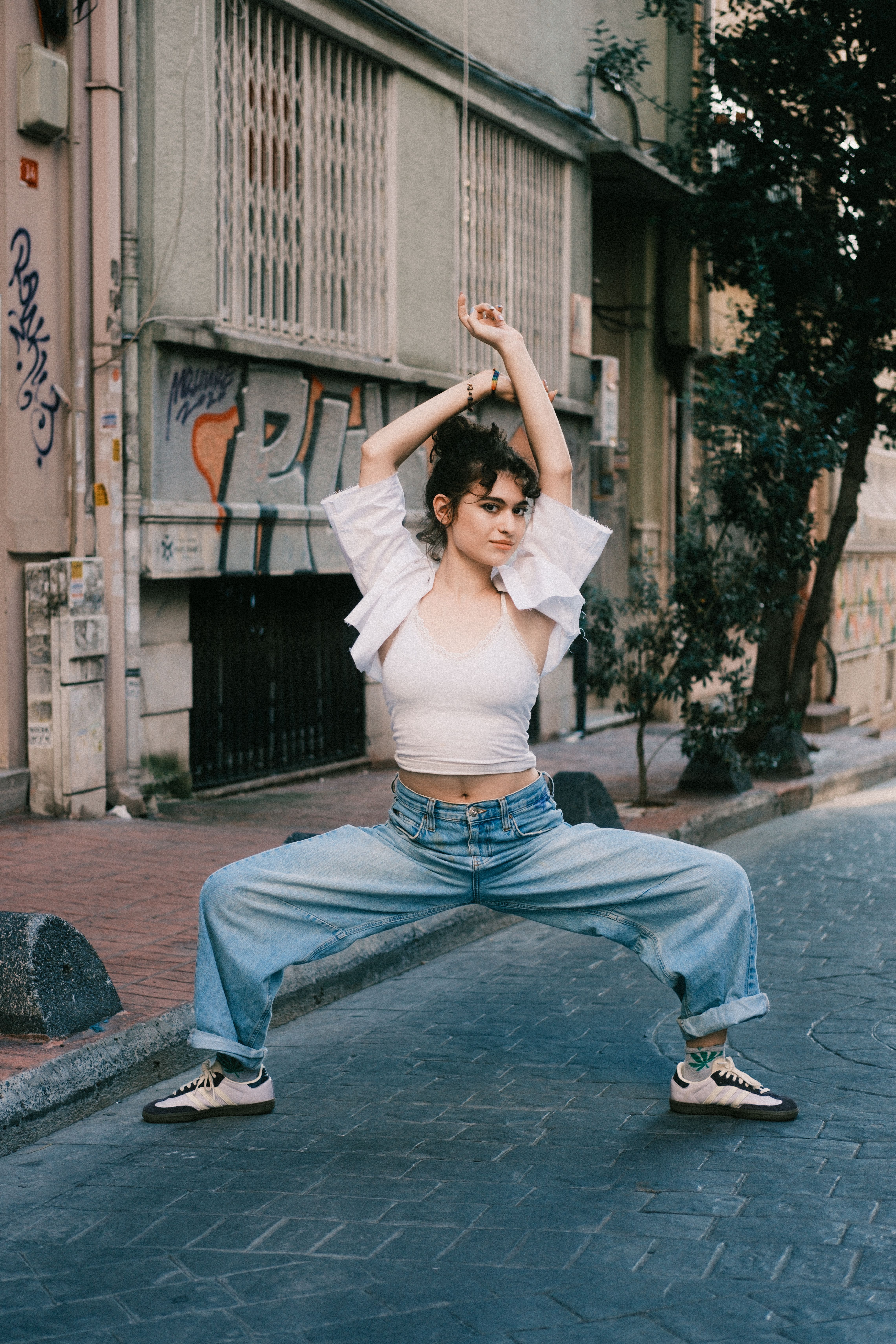 Young Woman Posing in Urban Street Setting · Free Stock Photo
