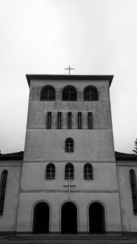 Monochrome photo of a historic church building showcasing architectural design in Uwemba, Tanzania.
