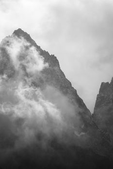 Dramatic black and white photo of misty mountain peaks in Washington.