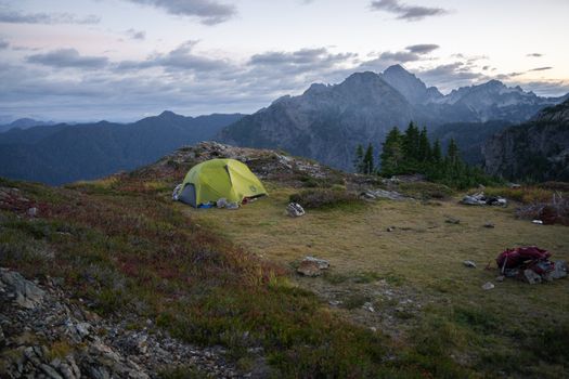 Serene camping scene in the wilderness of Three Fingers, Washington at sunrise.