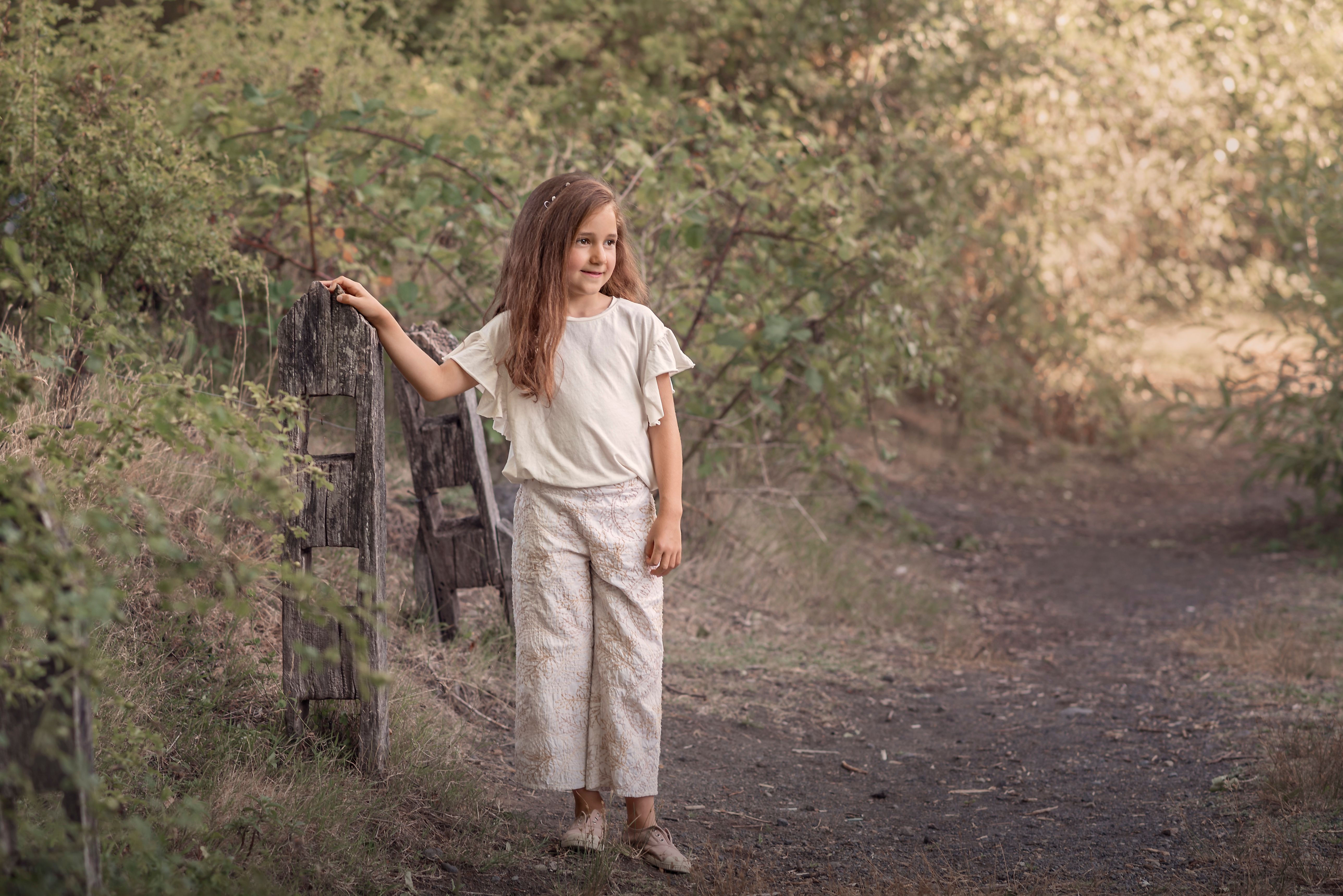 Charming Child Standing in Rustic Woodland Path · Free Stock Photo