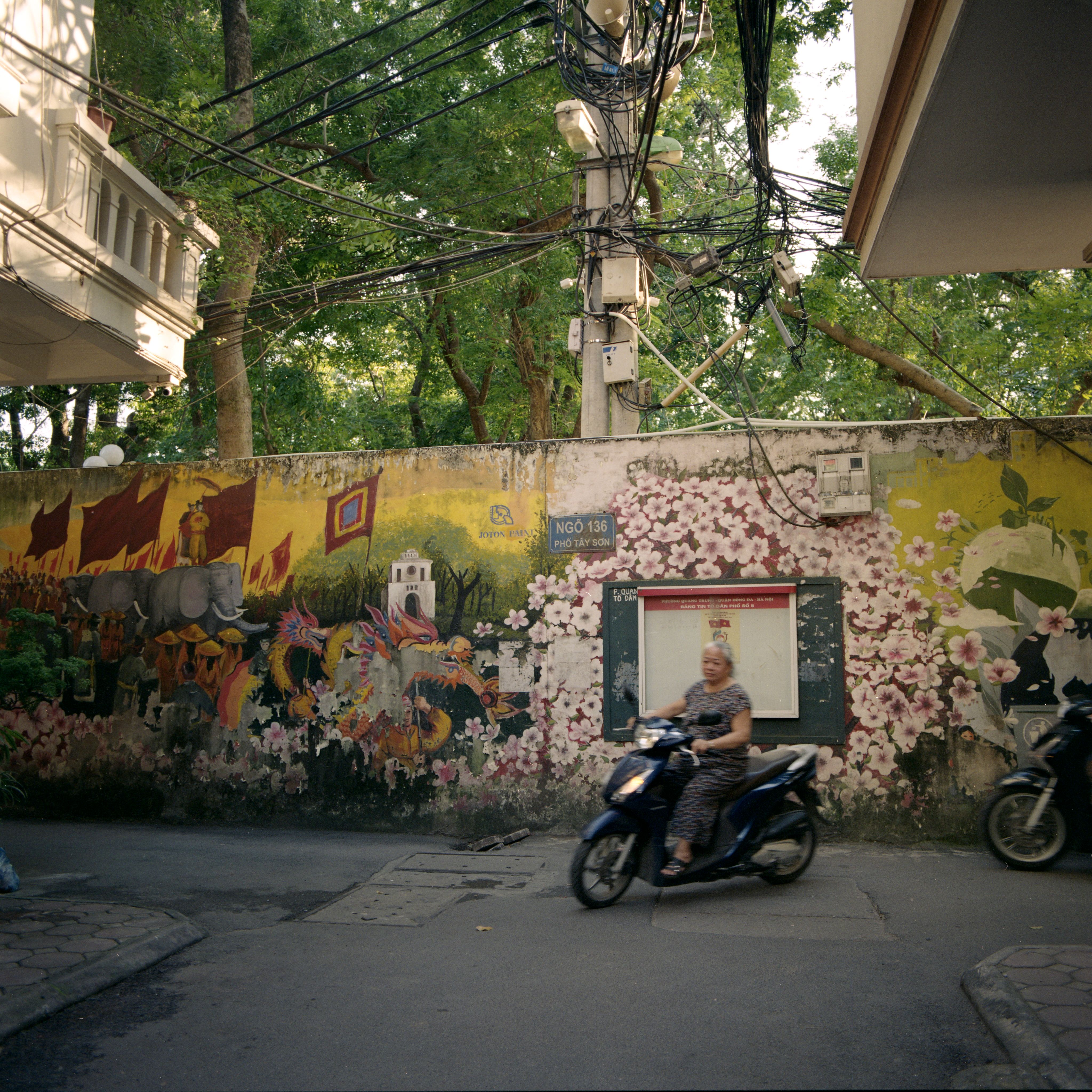 Street Art and Scooter on Hanoi Street Corner · Free Stock Photo