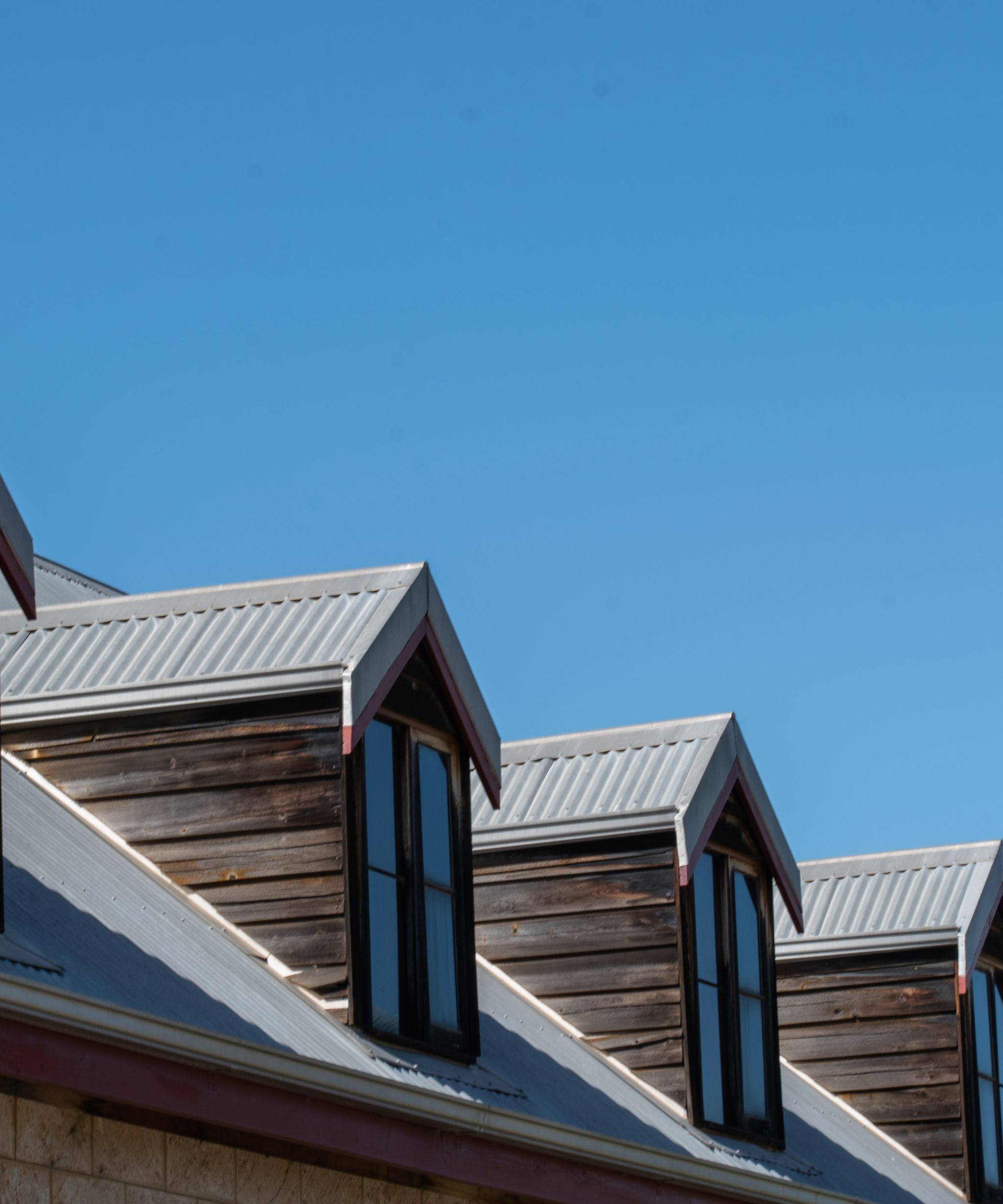 Roofer working on a house roof