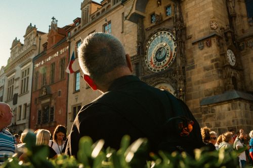 Free Tourists gather around the historic Prague Astronomical Clock in the Old Town Square, Czech Republic. Stock Photo