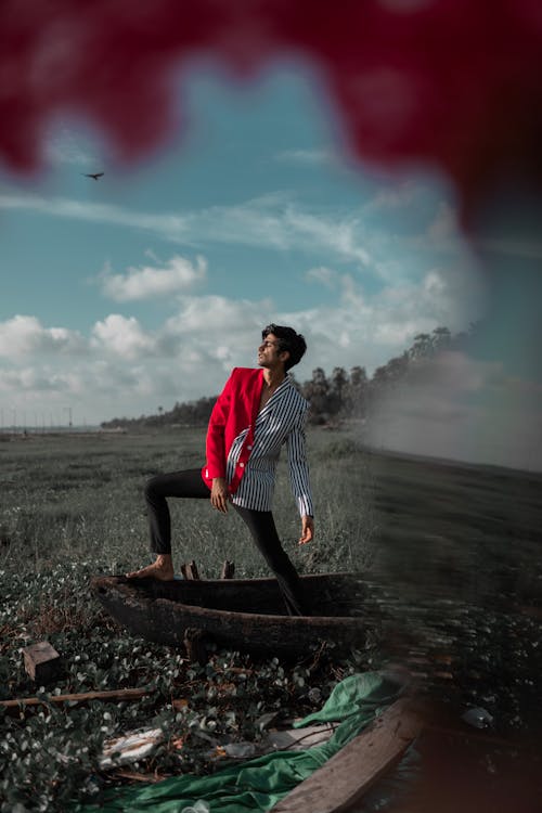 Man Standing on Canoe