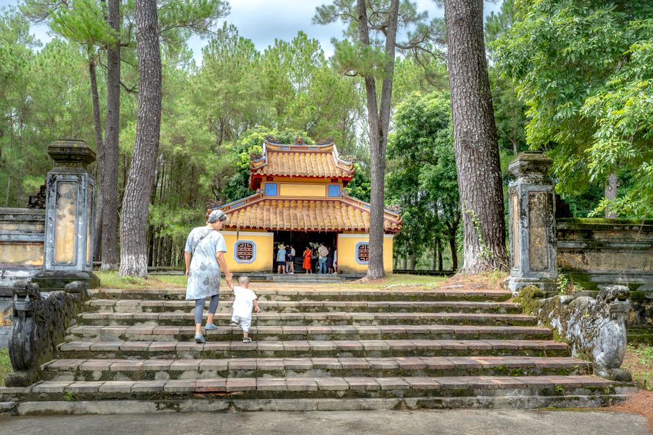 child walking ancient tomb park daytime