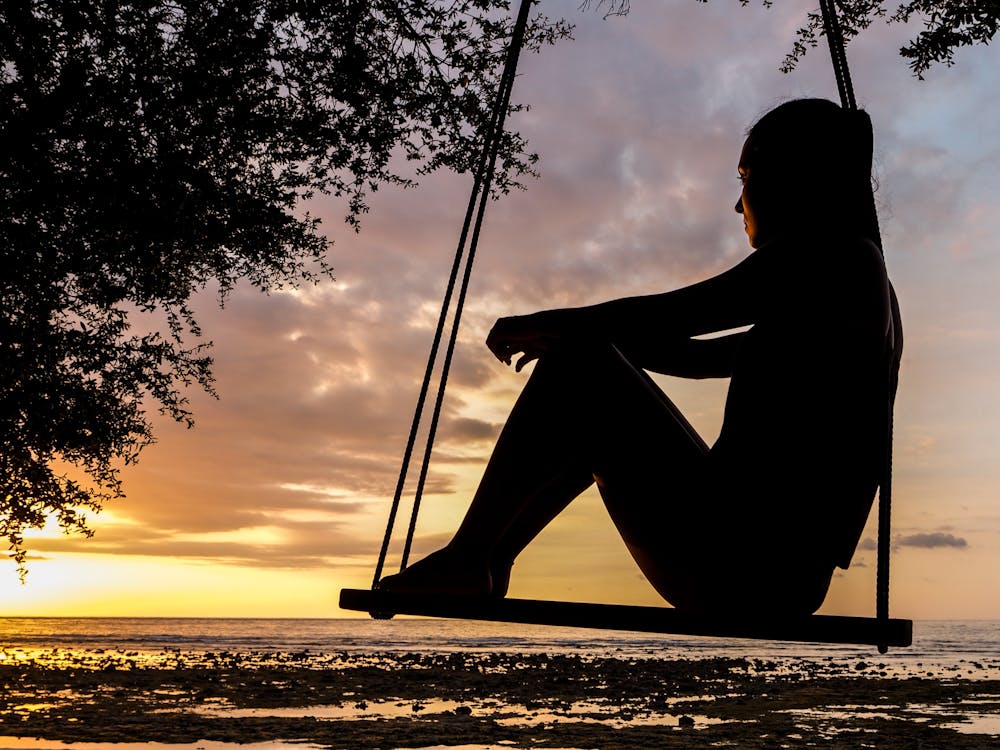 woman staring at the sunset 