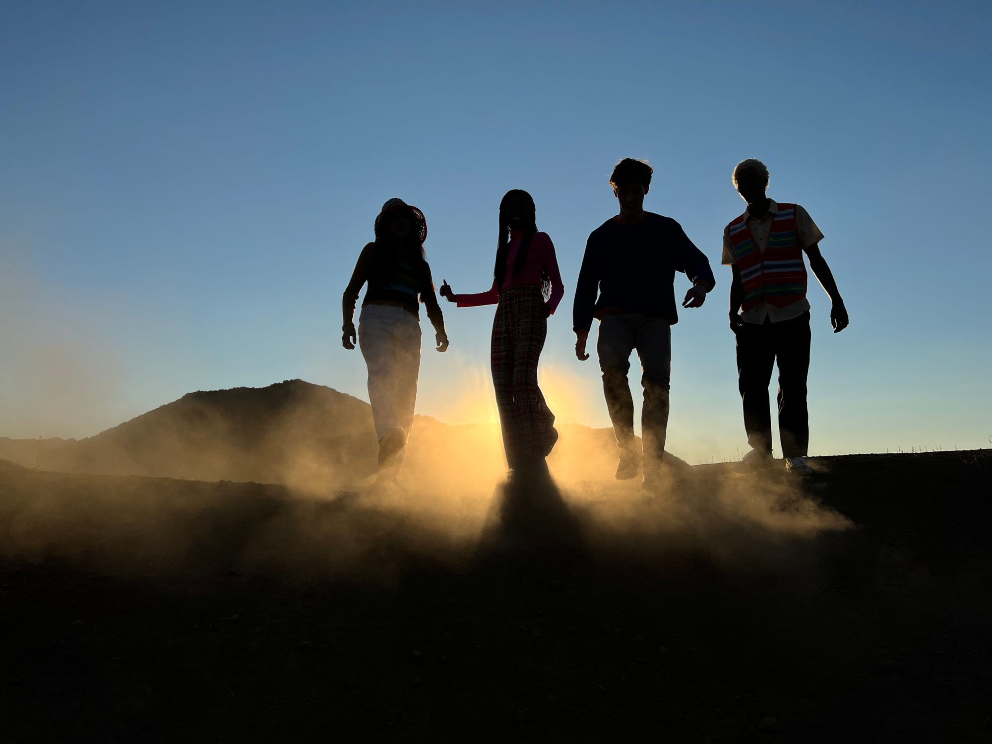 Silhouette of People Walking at Sunset Outdoors · Free Stock Photo