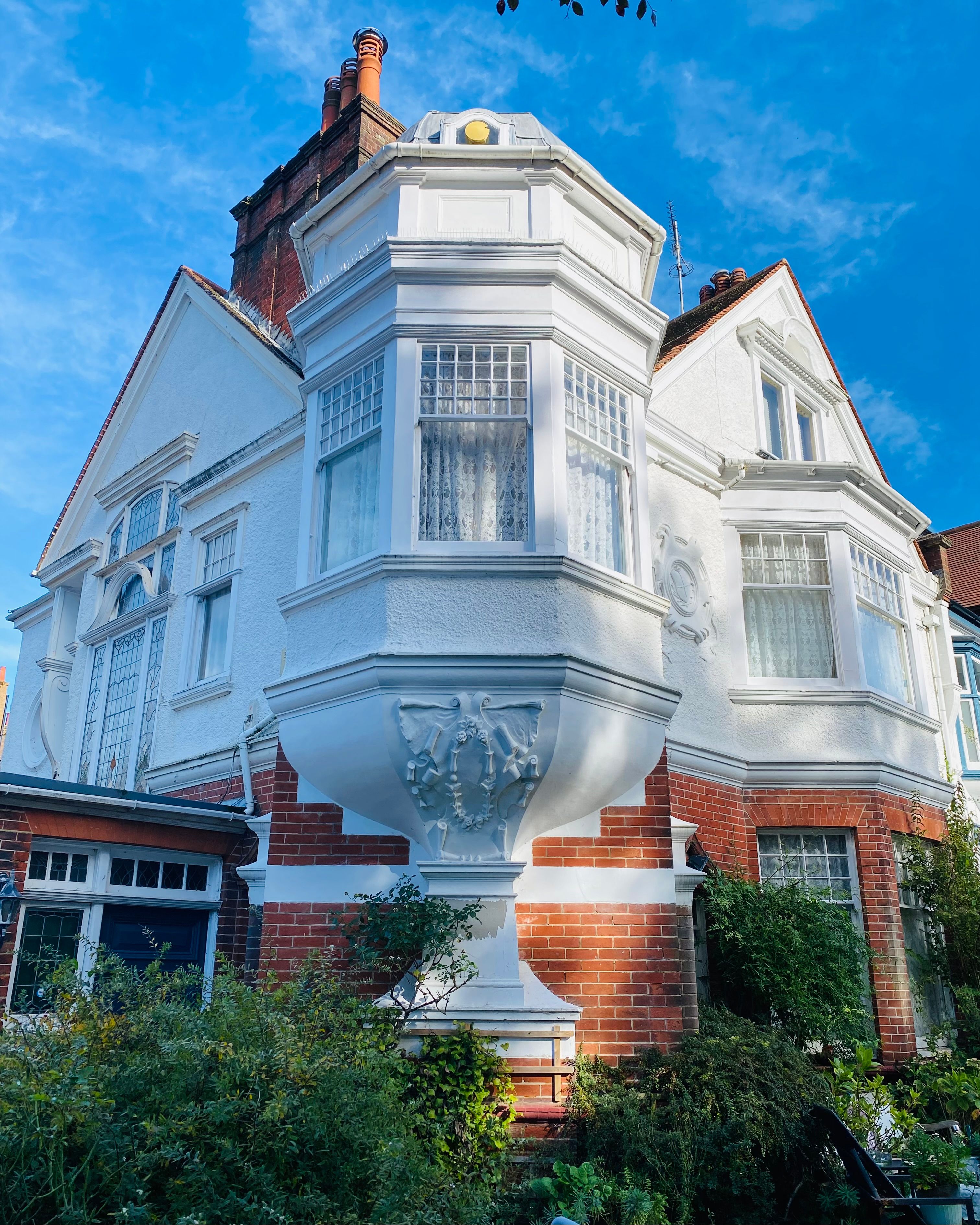 White Victorian house with bay windows, representative of older homes in the Cape May County seat