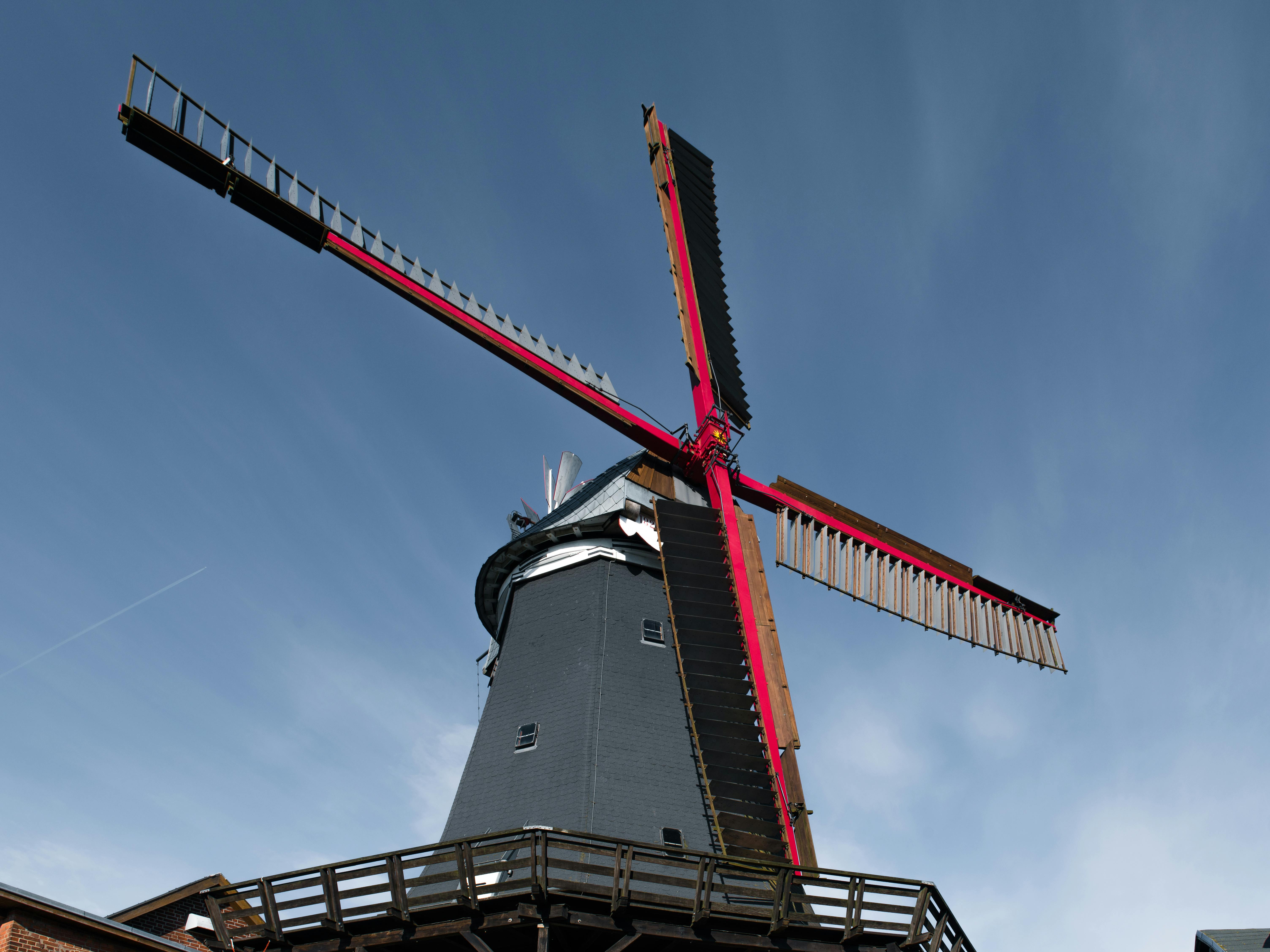 A captivating view of a historic windmill in Hamburg, showcasing traditional wind power technology.