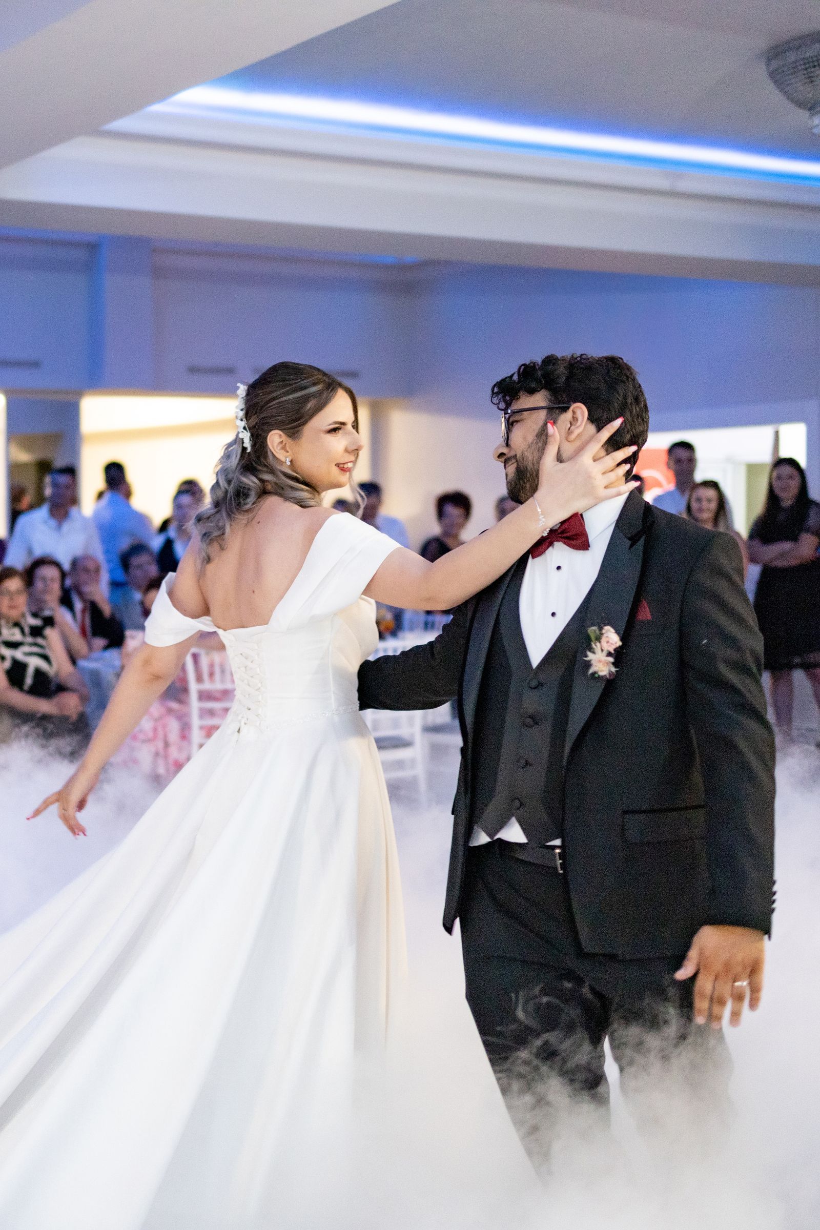 Wedding First Dance — bride in a wedding gown dancing with her groom in a tuxedo. Stock photo.