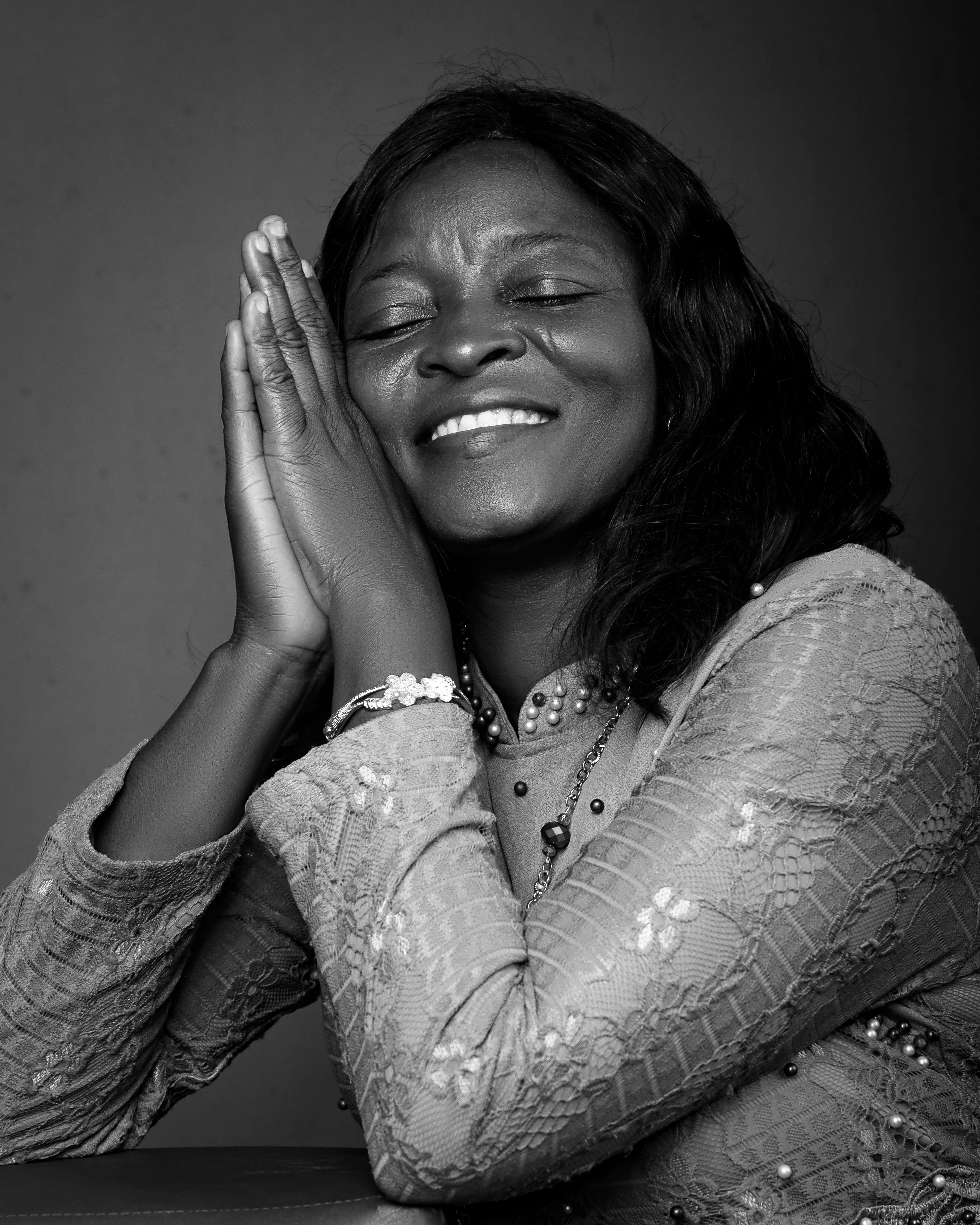 Serene Black and White Portrait of Smiling Woman · Free Stock Photo
