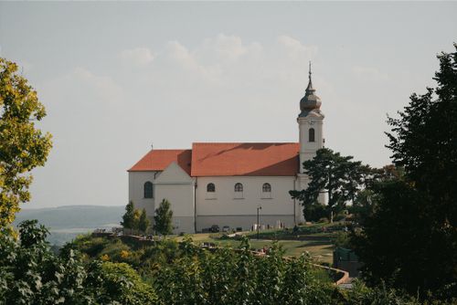 Free Capture of Tihany Abbey with verdant surroundings and clear skies in Hungary. Stock Photo