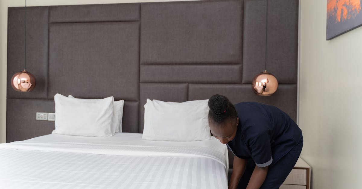 Cleaning Under The Bed In A Hotel Room