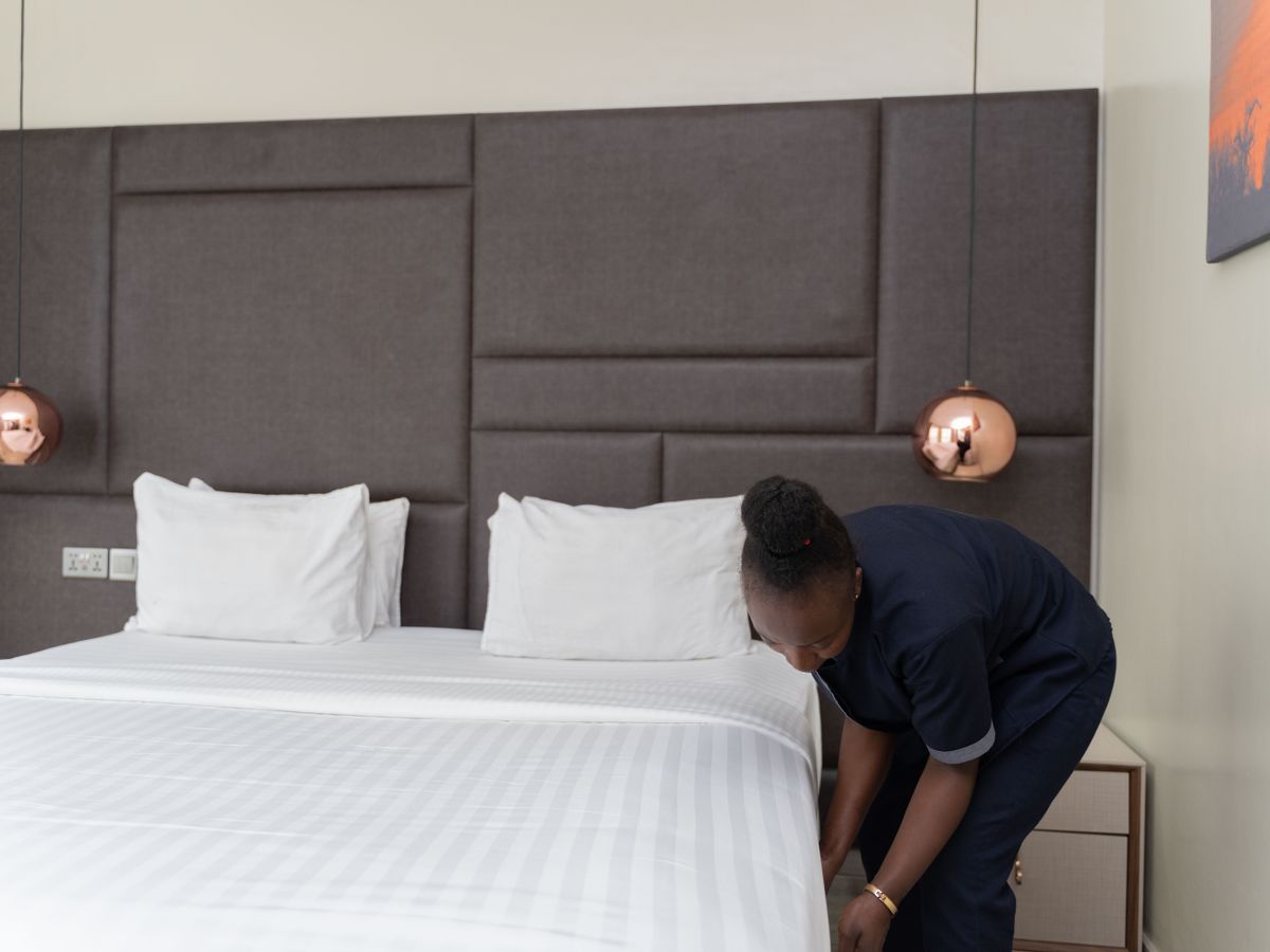 Fresh made bed in a short-term rental