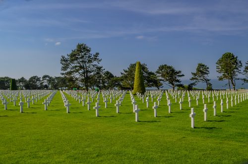Free Wide view of the American Cemetery in Normandy, depicting rows of crosses honoring WWII soldiers. Stock Photo
