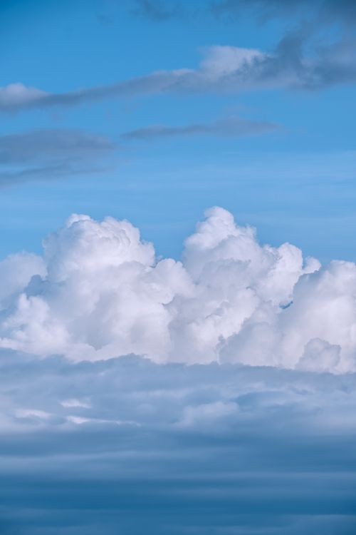 Free Breathtaking view of fluffy white clouds in a clear blue sky at Bodensee, Niedersachsen. Stock Photo