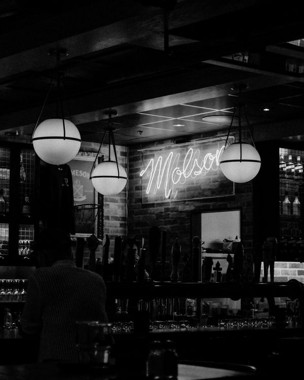 Moody Bar Scene with Neon Sign Lighting · Free Stock Photo