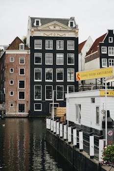 Picturesque view of Amsterdam's classic canal-side architecture.