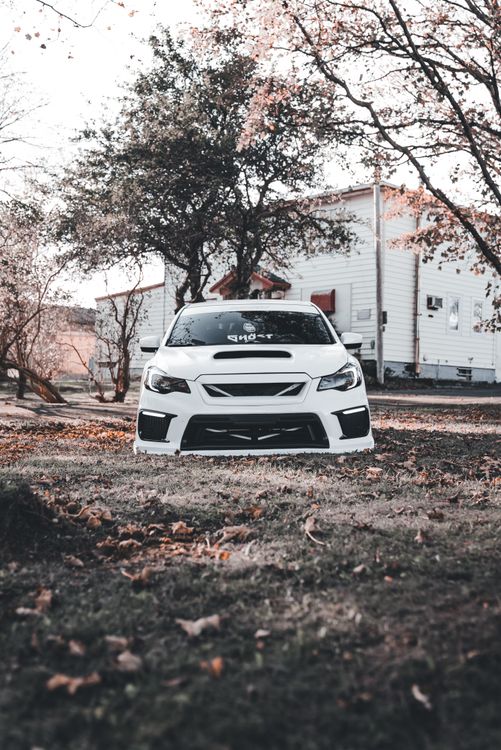 Car In Rural Setting White Sports Car in Autumn Rural Setting · Free Stock Photo