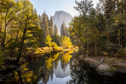 Free Explore the tranquil beauty of Half Dome reflecting in Yosemite's serene waters. Stock Photo