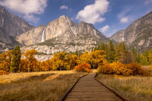 Free Stunning view of Yosemite Falls surrounded by autumn foliage. Stock Photo