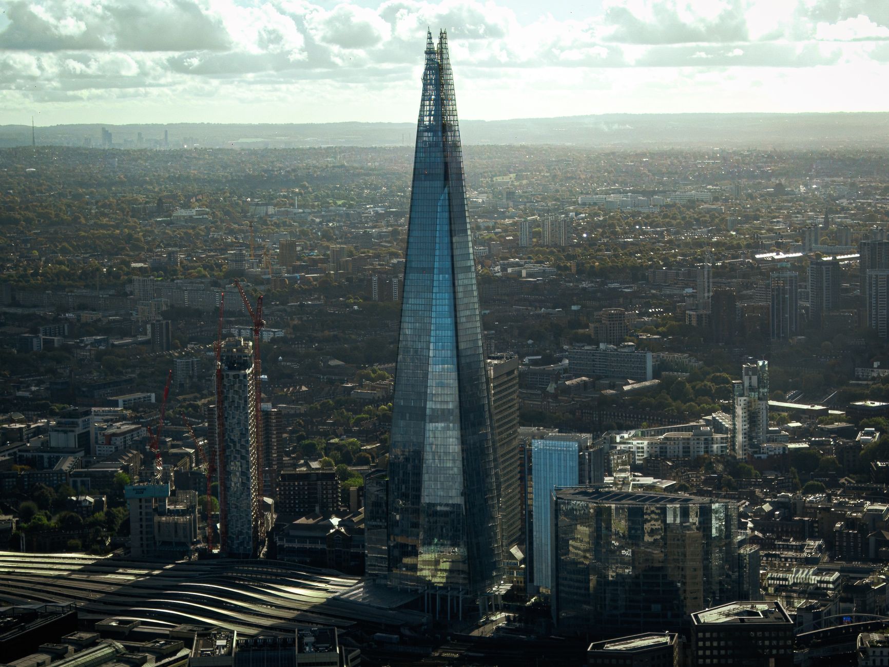 Stunning aerial view of The Shard, London's iconic skyline skyscraper during the day.