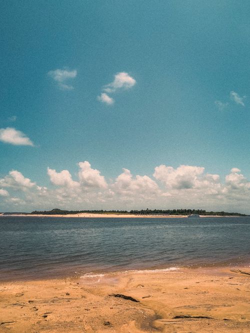 Free Discover the untouched beauty of Barra do Cunhaú beach in Rio Grande do Norte, Brazil, featuring golden sands and clear skies. Stock Photo