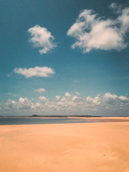 Sunny beach view at Barra do Cunhaú, Rio Grande do Norte. Natural beauty under clear skies.