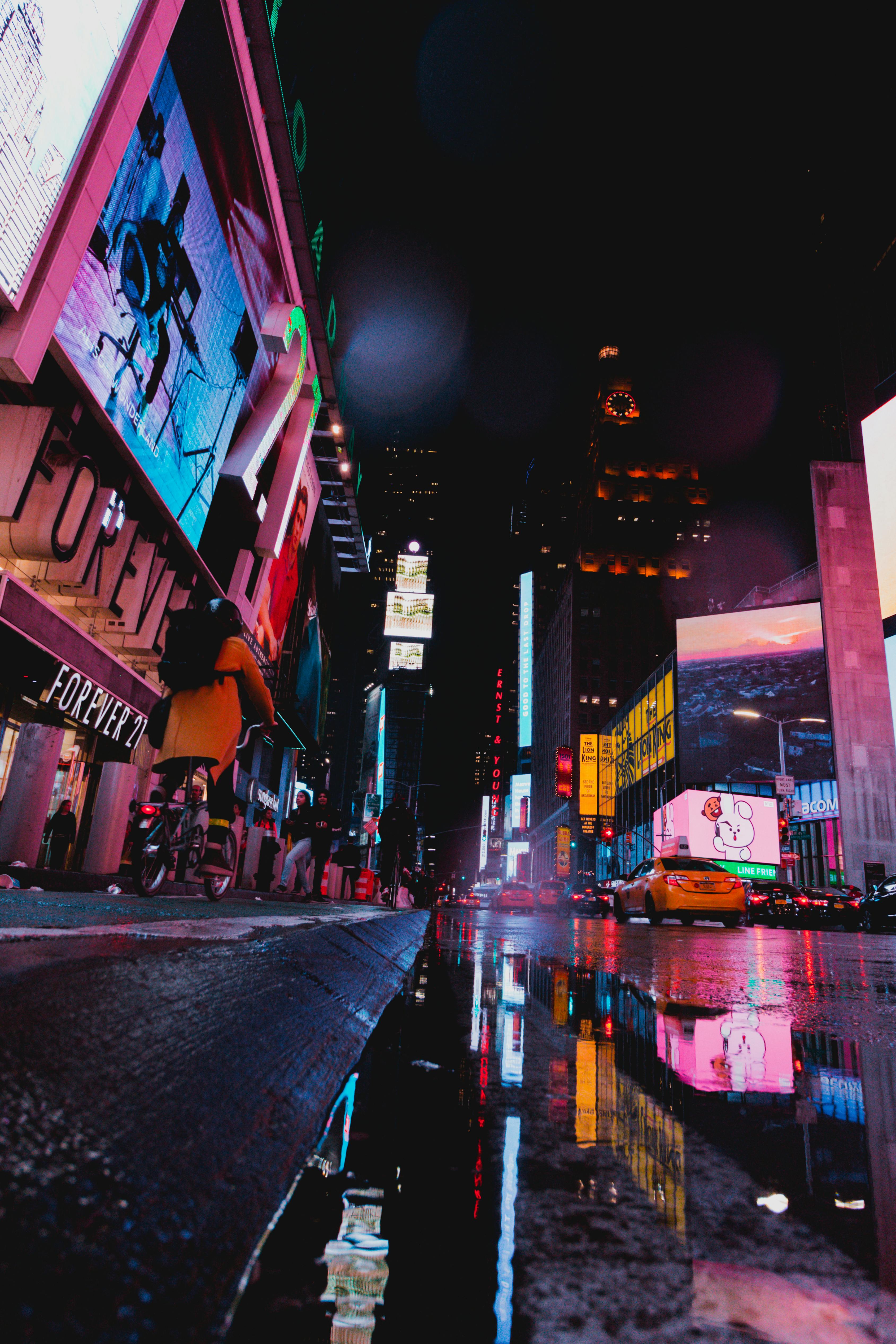 roadway surrounded by building during nighttime