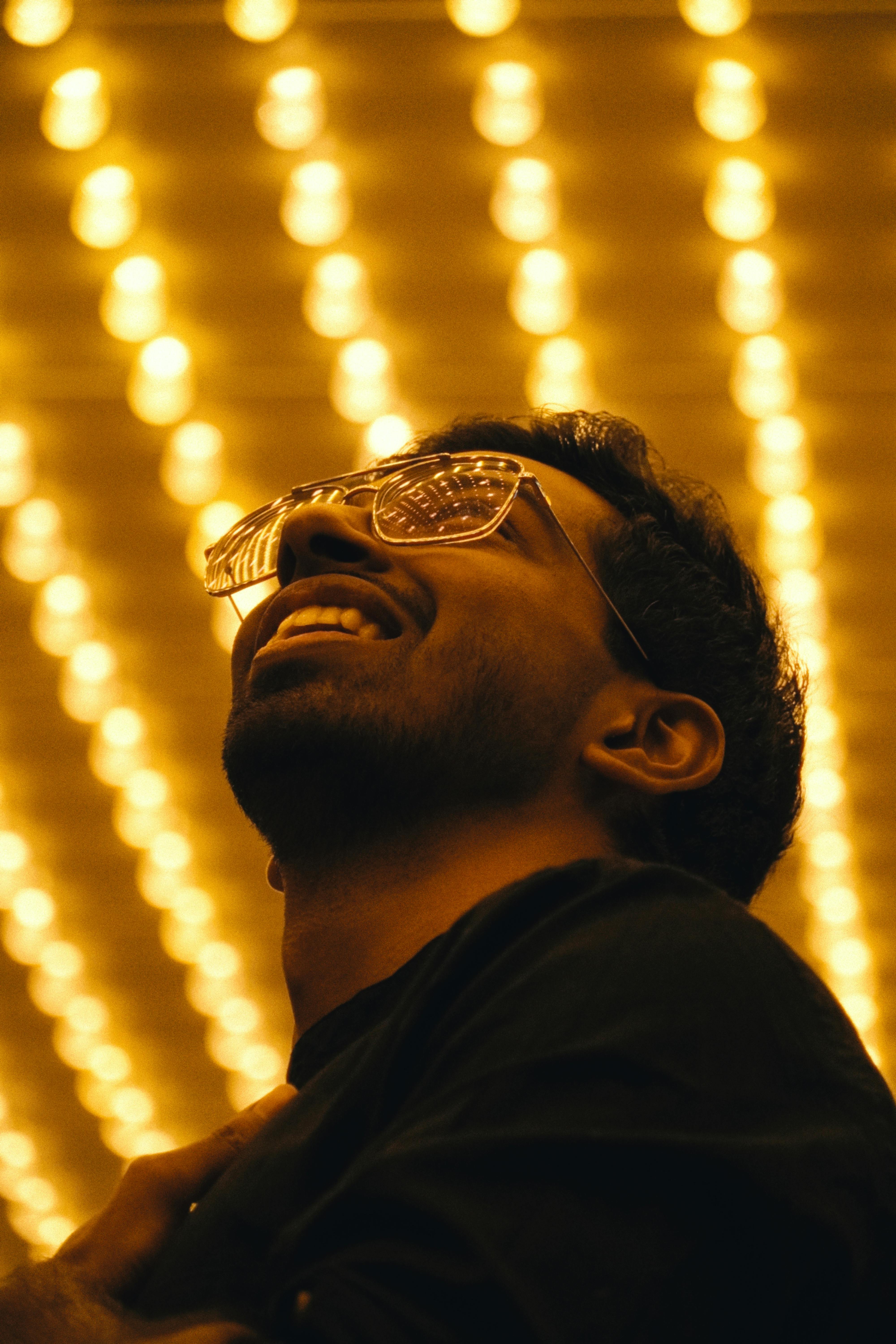Captivating night portrait under Toronto's glowing city lights, showcasing urban style.