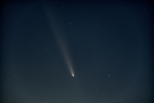 Free A stunning comet trails across the night sky in Chișinău, captured with bright stars. Stock Photo