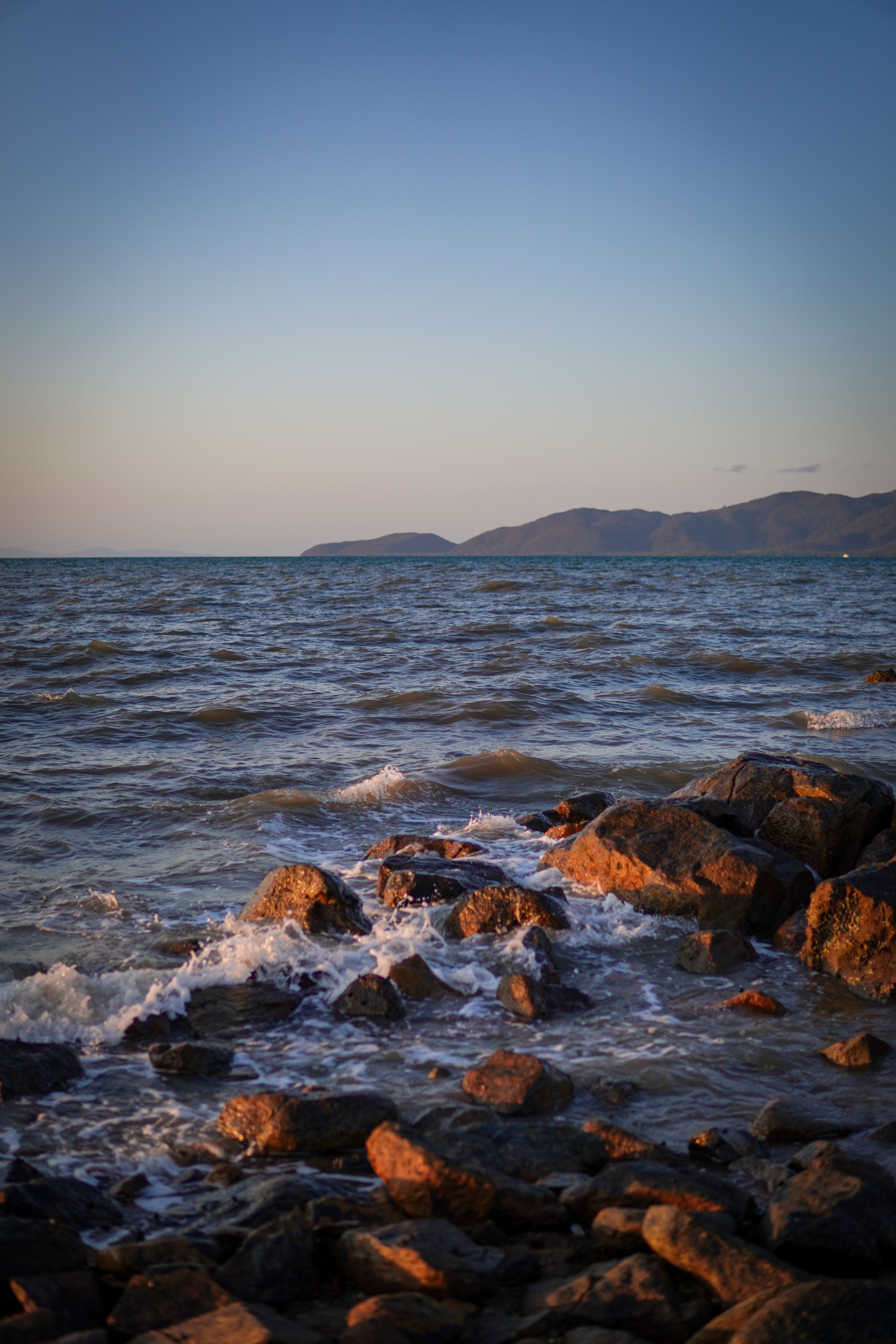 Serene Coastal Rocks at Sunset · Free Stock Photo