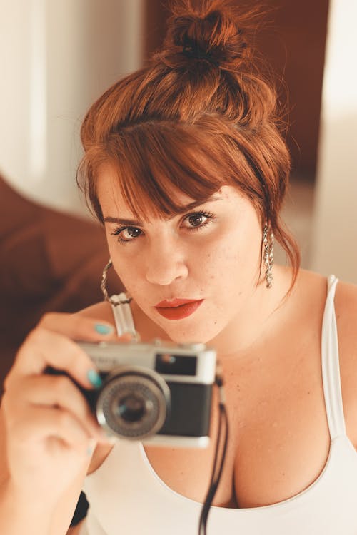 Portrait of Woman Holding Camera