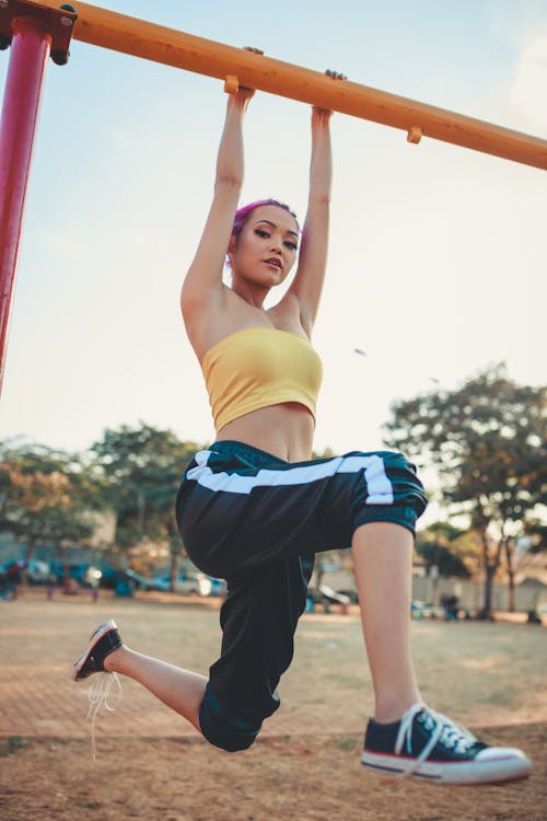 Free Photo Of Woman Hanging On Monkey Bars Stock Photo