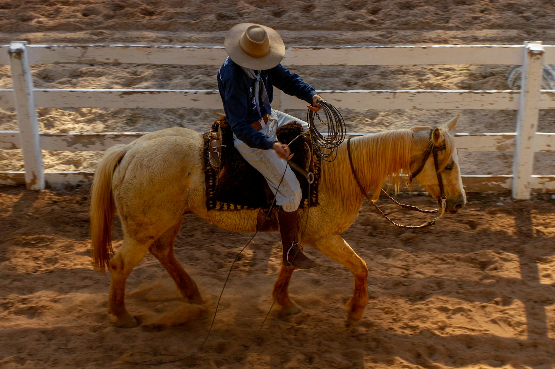 Brazilian Cowboy Riding Horse in Arena