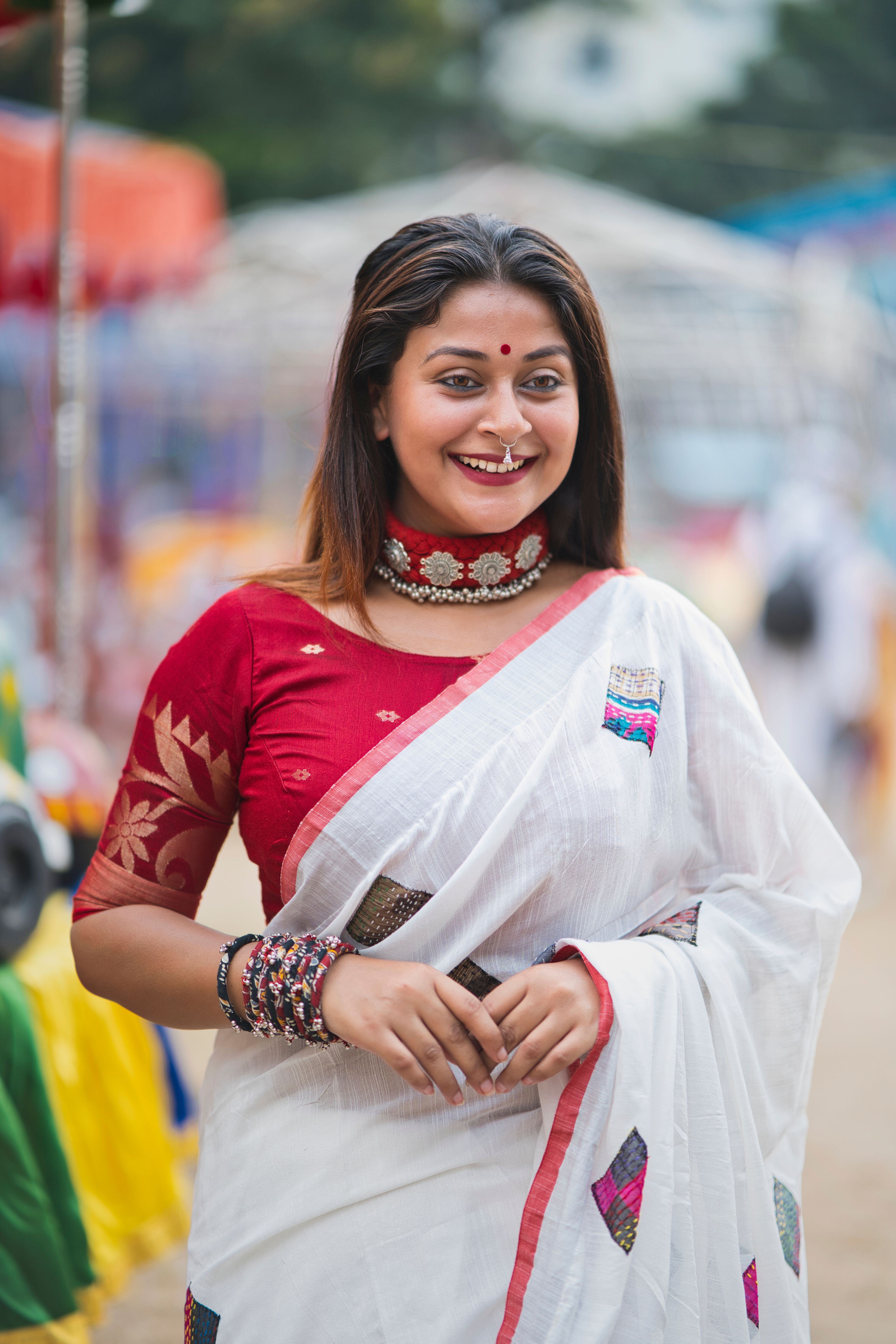 Smiling Woman in Traditional Ethnic Attire Outdoors · Free Stock Photo