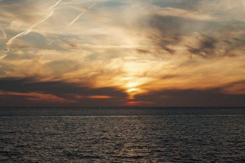 Free Stunning view of a vibrant sunset over the Black Sea in Sochi, showcasing dramatic clouds. Stock Photo