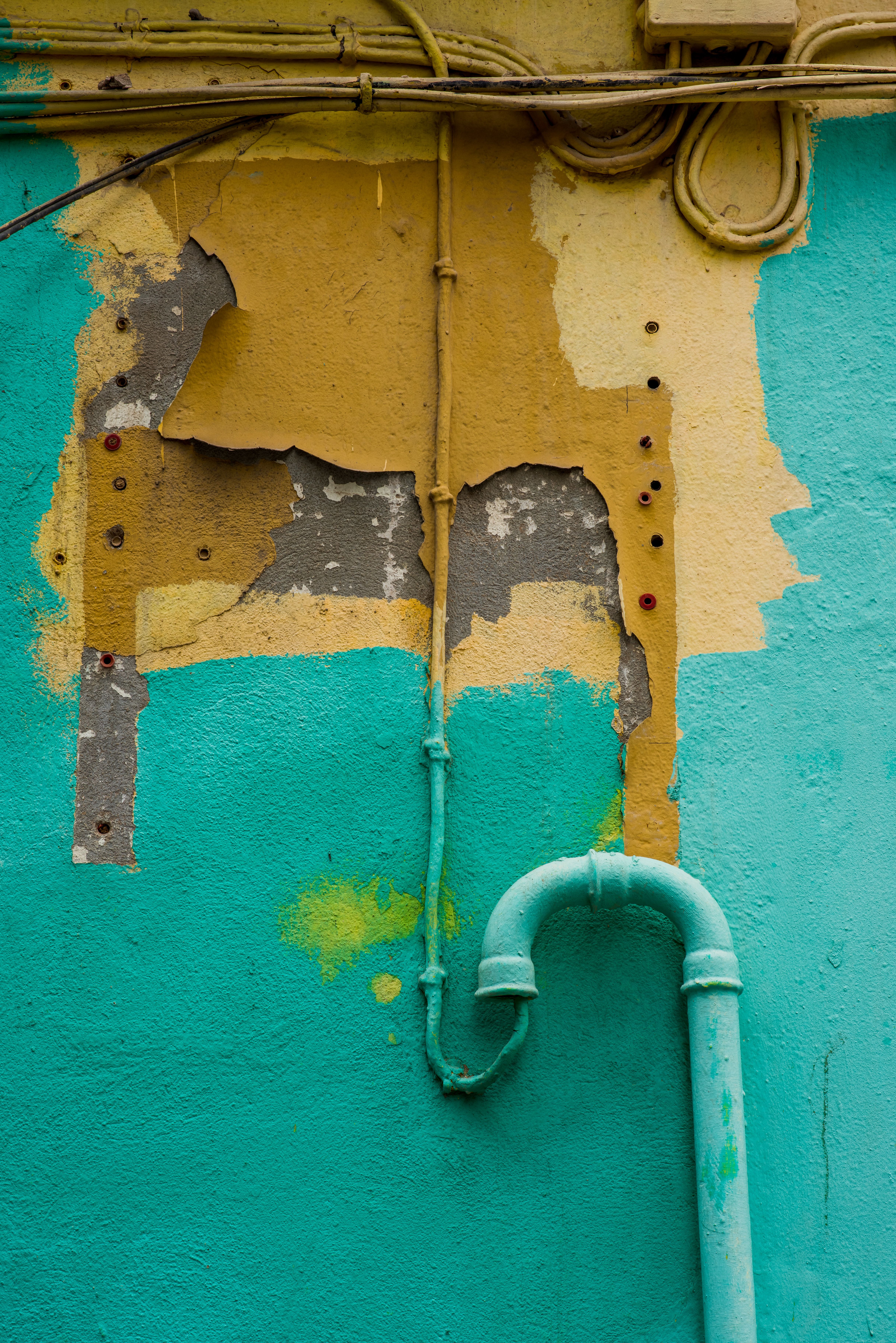 Picture Idea: Vibrant Urban Wall With Peeling Paint And Pipes