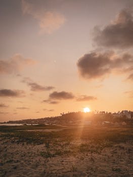 Serene sunset view over Barra do Cunhaú beach in Rio Grande do Norte, Brazil, showcasing natural beauty.