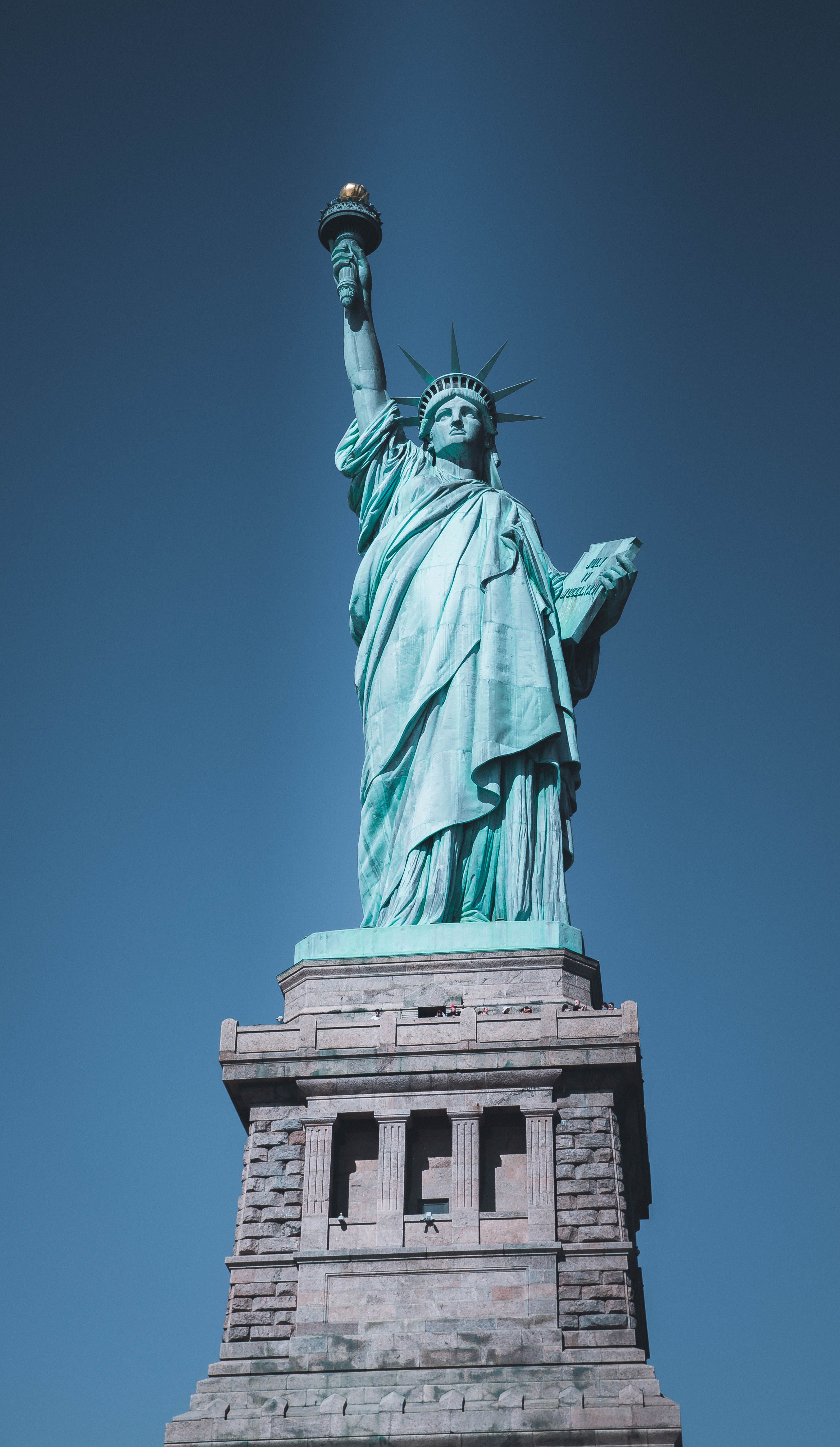 Iconic Statue of Liberty captured on a clear day in New York City.