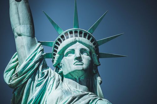Free Detailed view of the iconic Statue of Liberty in New York City under a clear blue sky. Stock Photo