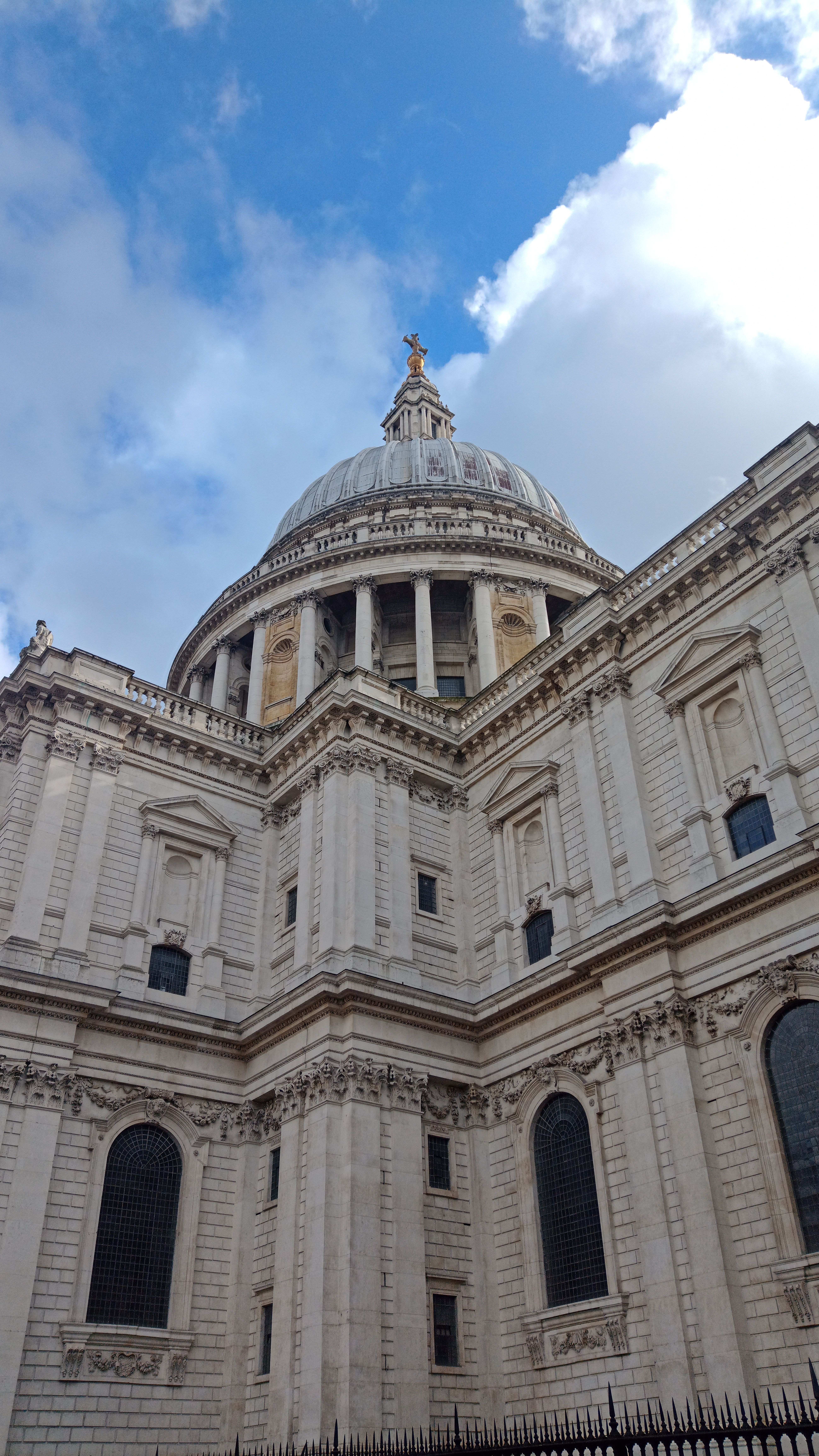 A majestic view of St. Paul's Cathedral in London with a clear blue sky overhead.