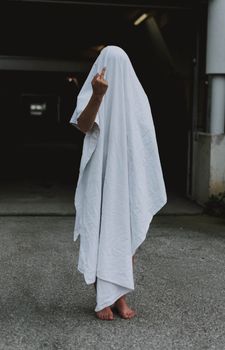 Person Covered by White Cloth